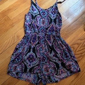Purple printed romper.Spaghetti strap with pockets